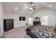 Main bedroom with a tray ceiling, fan, furnishings, and ample space at 412 Guildhouse Dr # 38, Mcdonough, GA 30252