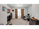 Home office area with a large window, desk, and neutral decor at 412 Guildhouse Dr # 38, Mcdonough, GA 30252