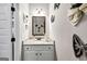 Stylish powder room features a granite countertop, updated vanity and decorative butterfly adornments at 412 Guildhouse Dr # 38, Mcdonough, GA 30252