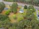 Aerial shot of a home with surrounding landscape and driveway access at 470 Old Griffin Rd, Hampton, GA 30228