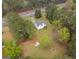 Aerial view of a quaint home, lush greenery, and driveway, surrounded by mature trees at 470 Old Griffin Rd, Hampton, GA 30228