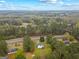 An elevated view of a property, nestled among dense, mature trees and lush, green landscaping at 470 Old Griffin Rd, Hampton, GA 30228