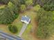 A high-angle shot shows a home with surrounding trees, yard, and driveway at 470 Old Griffin Rd, Hampton, GA 30228