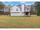 Back of home showing deck overlooking the large yard, with a door providing access to the backyard at 470 Old Griffin Rd, Hampton, GA 30228