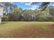 Expansive backyard with mature trees offering privacy and a serene natural setting at 470 Old Griffin Rd, Hampton, GA 30228
