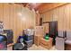 Unfinished basement area offering ample storage space, with a concrete floor and paneled walls at 470 Old Griffin Rd, Hampton, GA 30228