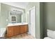 Bathroom featuring double sink vanity, neutral color palette, and bright lighting at 470 Old Griffin Rd, Hampton, GA 30228