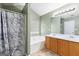 Bright bathroom with double vanity, tub-shower, and ample cabinet storage at 470 Old Griffin Rd, Hampton, GA 30228