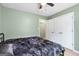 Cozy bedroom with ceiling fan, large closet, and neutral color palette at 470 Old Griffin Rd, Hampton, GA 30228