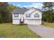 Charming two-story home featuring a well-manicured lawn and a double garage, perfect for Gathering living at 470 Old Griffin Rd, Hampton, GA 30228