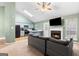 Inviting living area features a cozy fireplace and large windows, perfect for relaxation at 470 Old Griffin Rd, Hampton, GA 30228