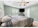 Comfortable main bedroom with tray ceiling, ceiling fan, and large window at 470 Old Griffin Rd, Hampton, GA 30228