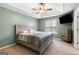 Spacious main bedroom with tray ceiling, ceiling fan, large window and plenty of room at 470 Old Griffin Rd, Hampton, GA 30228