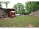 Large backyard with a covered deck, ideal for outdoor entertaining and relaxation at 208 Holliday Way, Carrollton, GA 30116