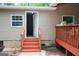 Back of house and deck with wood stairs at 208 Holliday Way, Carrollton, GA 30116