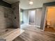 Bathroom featuring neutral paint, hard surface flooring and a shower stall at 208 Holliday Way, Carrollton, GA 30116