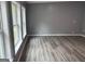 Bedroom features hard surface floors, a window, and a neutral paint at 208 Holliday Way, Carrollton, GA 30116