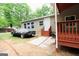 Charming single-story home with a covered car and wooden steps leading to the front door at 208 Holliday Way, Carrollton, GA 30116
