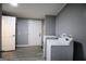 A laundry room features a washer and dryer at 208 Holliday Way, Carrollton, GA 30116
