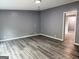 Room with hard surface floors and neutral paint at 208 Holliday Way, Carrollton, GA 30116