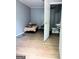 Small room includes access to a bathroom with a toilet and sink at 208 Holliday Way, Carrollton, GA 30116
