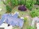 Aerial shot showcases a well-manicured backyard with a fire pit and lush landscaping at 3550 N Bogan Rd, Buford, GA 30519