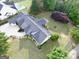 Aerial view of a private backyard featuring a pool, patio, and beautifully landscaped garden at 3550 N Bogan Rd, Buford, GA 30519