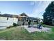 Expansive backyard featuring a firepit area with Adirondack chairs, perfect for relaxing and entertaining guests at 3550 N Bogan Rd, Buford, GA 30519
