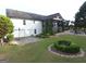 Expansive backyard with patio, fire pit, and lush landscaping offers an outdoor retreat at 3550 N Bogan Rd, Buford, GA 30519