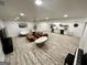Large finished basement includes a living area, kitchenette, and modern flooring at 3550 N Bogan Rd, Buford, GA 30519