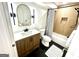 Modern bathroom features a vanity, sleek fixtures, and a shower-tub combination with stylish tile and accents at 3550 N Bogan Rd, Buford, GA 30519