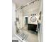 Modern bathroom featuring a glass-enclosed shower, floating vanity, and stylish fixtures at 3550 N Bogan Rd, Buford, GA 30519