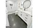 Contemporary bathroom featuring a glass-enclosed shower and stylish vanity with black accents at 3550 N Bogan Rd, Buford, GA 30519