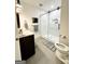 Bright bathroom with a walk-in shower, a gray vanity, and a framed mirror at 3550 N Bogan Rd, Buford, GA 30519