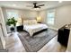 Cozy bedroom with lots of natural light, a ceiling fan, and a decorative rug at 3550 N Bogan Rd, Buford, GA 30519