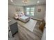 Cozy bedroom with gray walls, pink bed, and a large window overlooking the backyard at 3550 N Bogan Rd, Buford, GA 30519