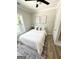 Bright bedroom with a large bed, decor, modern art and natural light from a window at 3550 N Bogan Rd, Buford, GA 30519