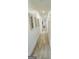 Inviting hallway with wood-style flooring and recessed lighting leads to other rooms in the house at 3550 N Bogan Rd, Buford, GA 30519