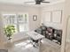 Bright home office with a modern desk, comfortable chair, and a plant, offering an inspiring workspace at 3550 N Bogan Rd, Buford, GA 30519