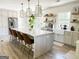 Beautiful kitchen with a large island, pendant lights, and stainless steel appliances at 3550 N Bogan Rd, Buford, GA 30519