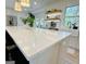 Beautiful kitchen island with white countertops, pendant lights, and bar seating, perfect for entertaining guests at 3550 N Bogan Rd, Buford, GA 30519