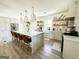 Bright kitchen with a large island, pendant lights, lots of natural light and stainless appliances at 3550 N Bogan Rd, Buford, GA 30519