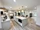 Bright and airy kitchen with stainless steel appliances, a spacious island, and modern pendant lighting at 3550 N Bogan Rd, Buford, GA 30519