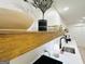 Modern kitchenette features floating shelves, white quartz countertops, and stylish décor at 3550 N Bogan Rd, Buford, GA 30519