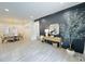 Bright and spacious living room with an adjacent dining room, showcasing modern flooring and stylish decor at 3550 N Bogan Rd, Buford, GA 30519