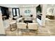 Spacious living space with fireplace, sitting room, large sectional, and plank flooring at 3550 N Bogan Rd, Buford, GA 30519