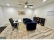 Home office area with a modern desk, blue velvet sitting chairs, and plenty of room to work at 3550 N Bogan Rd, Buford, GA 30519