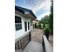 Inviting outdoor patio with manicured landscaping, brickwork, and a view of the sparkling pool, creating an ideal entertainment space at 3550 N Bogan Rd, Buford, GA 30519