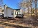 Back exterior view of home with a chimney and a deck that overlooks the large backyard at 473 Amy Blvd, Temple, GA 30179