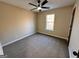 Bedroom features neutral paint, carpet floors, and a single window providing natural light at 473 Amy Blvd, Temple, GA 30179
